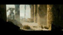 a scene from a movie with a robot and a palm tree in the background