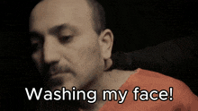 a man in a jail cell with the words washing my face below him