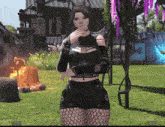 a woman in a black top and fishnet shorts stands in a grassy field