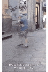 a little boy is walking down a street and says `` how i 'll celebrate my birthday ! ''