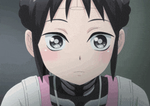 a close up of a girl 's face with a circle on her head
