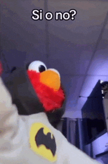 elmo from sesame street is wearing a batman shirt and asking if o no ?