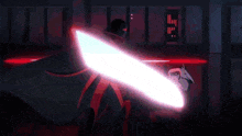 darth vader is holding a light saber in a dark room with a red background