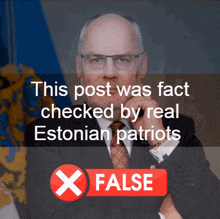 a man in a suit and tie stands in front of a banner that says this post was fact checked by real estonian patriots false