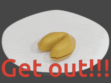 a yellow fortune cookie with a piece of paper that says " fuck off "