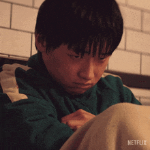 a close up of a person with a netflix logo on the bottom right