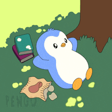 a penguin is laying in the grass with books and a bag of potato chips