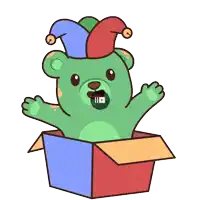 a green teddy bear wearing a jester hat is sitting in a cardboard box