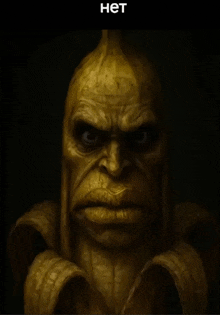 a statue of a man with a banana peel on his head and the word het below it