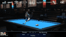 a man playing pool with a shirt that says van boening
