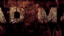 the word adm is written on a dirty wall
