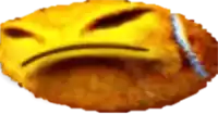 a close up of a fried food item with a face on it
