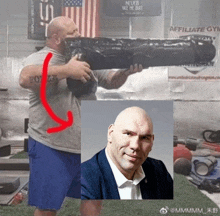 a man in a grey shirt with the word forza on it is holding a black bag