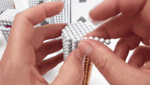 a person is playing with a toy that looks like a toothbrush