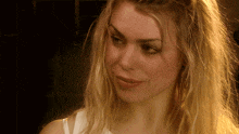 a close up of a woman with blonde hair