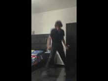 a person dancing in a bedroom with a bed with a soccer blanket