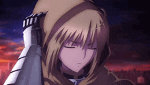 a girl with blonde hair and a hood on her head