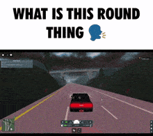 a red car is driving down a road with the words what is this round thing above it