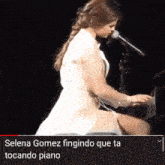selena gomez singing into a microphone while playing the piano
