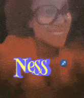 a woman wearing glasses with the word ness written on her face