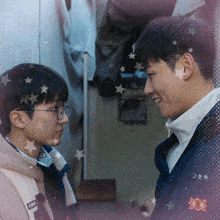 two young men looking at each other with one wearing a jacket that says ' ffk ' on it