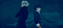 a man and woman are standing next to each other in a dark forest .