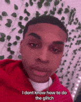a young man in a red hoodie says i dont know how to do the glitch .