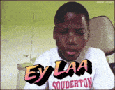 a boy wearing a shirt that says ey laa souderton on it