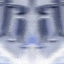 a blurred image of a person 's face with a blue and white background