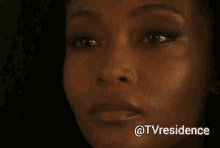 a close up of a woman 's face with the hashtag @tvresidence