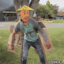 a man in a cardboard box costume with the word cookie on the bottom right corner