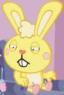 a cartoon bunny with a heart on its nose is sitting down