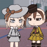 a girl in a white hat is standing next to a girl in a yellow skirt