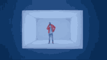 a man in a red jacket is standing in a small room