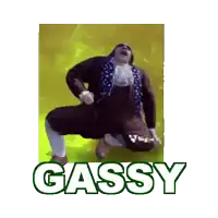 a man in a suit is dancing with the word gassy behind him