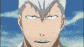 a close up of a man 's face with a very angry look on his face
