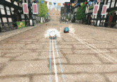 a cartoon character is driving down a brick road in a video game with a sign that says ' kart world ' on it