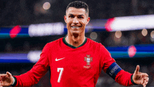 a soccer player wearing a red jersey with the number 7 on it