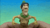 a person is holding a toy in their hand with a green hat on