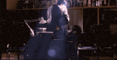 a man and a woman hugging in a dark room