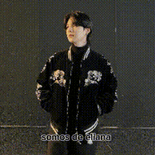 a woman is covering her mouth with her hand and the words somos de ellana are written above her