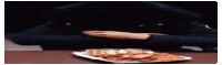 a person is taking a slice of pizza from a plate of waffles .