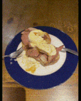 a plate of food with a fork and knife on a table
