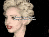 a close up of a woman 's face with blonde hair and red lipstick .