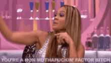 a woman is taking a picture of herself in a bar and says you 're a non muthafuckin factor bitch