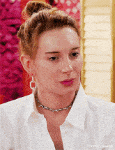 a close up of a woman wearing a necklace and hoop earrings with t4yce tumblr at the bottom