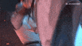 a close up of a person 's torso with chinese writing on the bottom