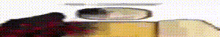 a blurred image of a book and a mirror on a table .