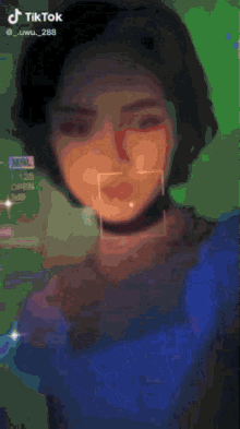a tiktok video of a person 's face with a purple background