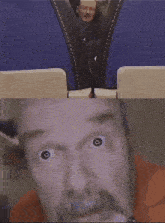 a close up of a man 's face with a blue background